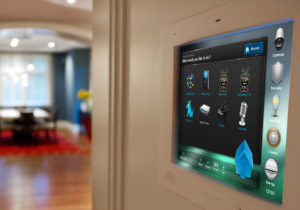 Wall mounted home automation device for in-room control of lights, blinds, sound and more. Automation installation in London by Visionworks.